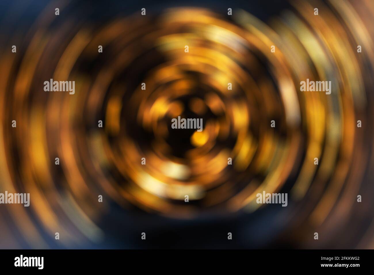 sfondo astratto con una spirale di colore dorato Foto Stock