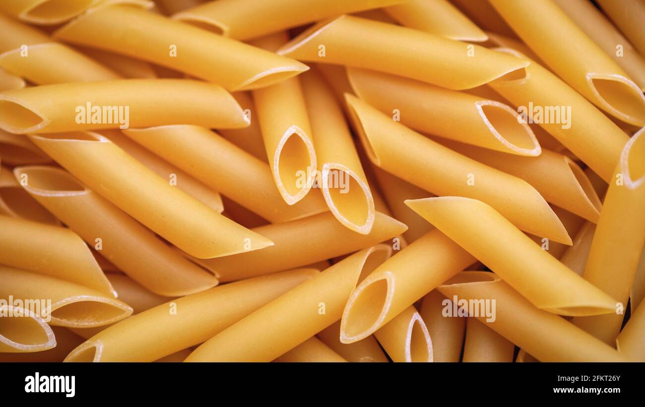 Penne lisce pasta cibo di fondo Foto Stock