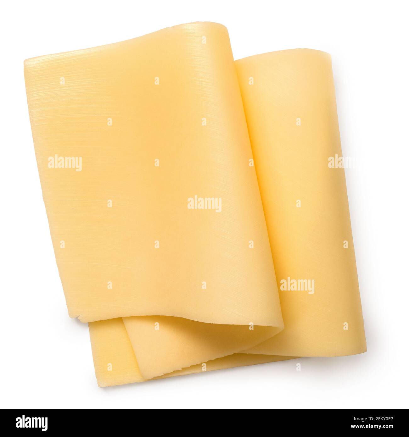 Due sottili fette ripiegate di formaggio giallo isolate su bianco. Vista dall'alto. Foto Stock