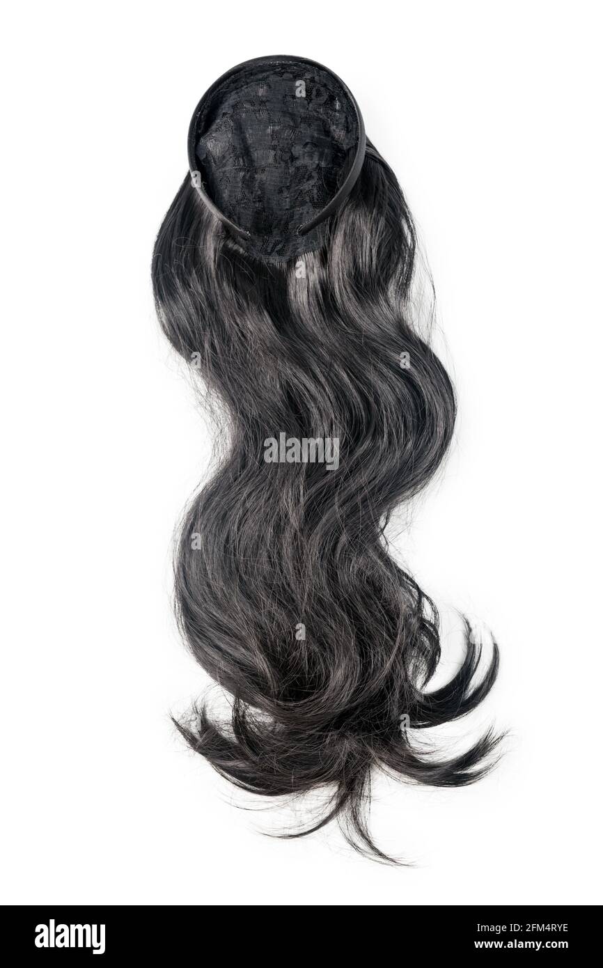 Wig nero femmina isolato su sfondo bianco. Capelli umani lunghi e scuri tessiture, estensioni e parrucche. Concetto di bellezza della donna. Foto Stock