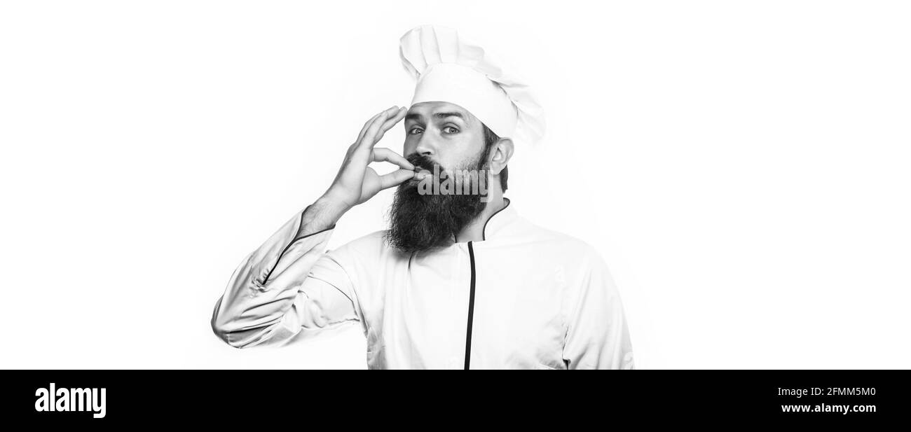 Chef professionista che mostra il segno per Delicious. Chef, cucinare facendo gustoso gesto delizioso baciando le dita. Cuoci cappello. Bianco e nero Foto Stock