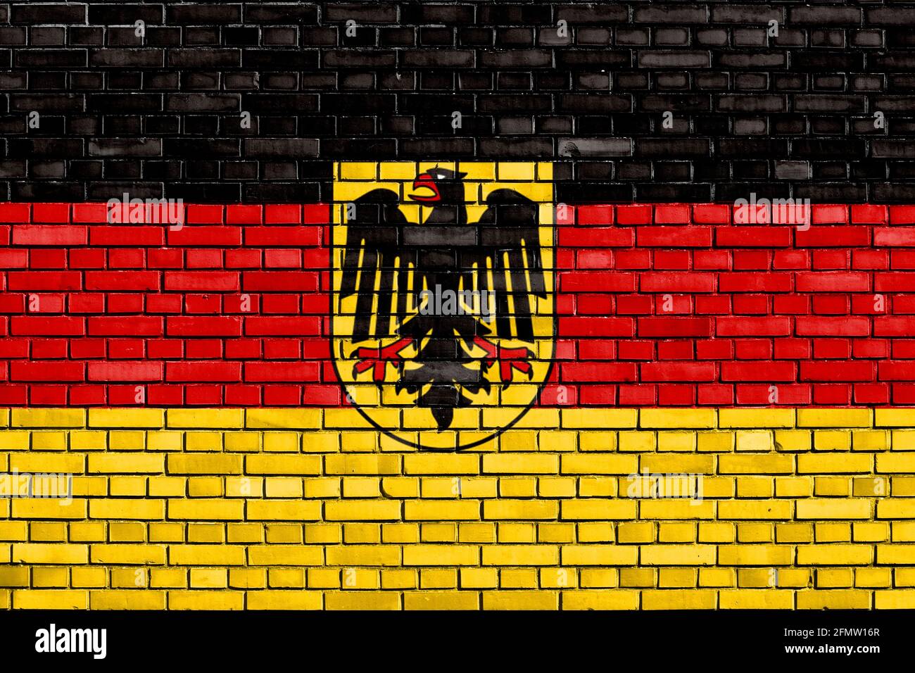 Bandiera storica della Germania occidentale dipinta su muro di mattoni Foto Stock