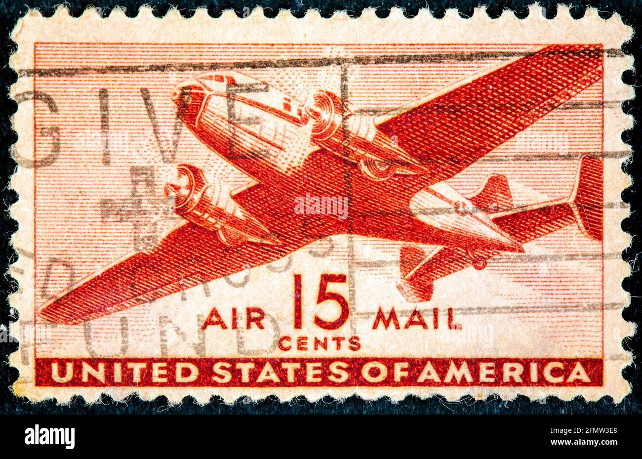 STATI UNITI D'AMERICA - CIRCA 1943: Un francobollo usato US Air Mail raffigurante un'illustrazione di un aereo da trasporto vintage circa 1943 Foto Stock
