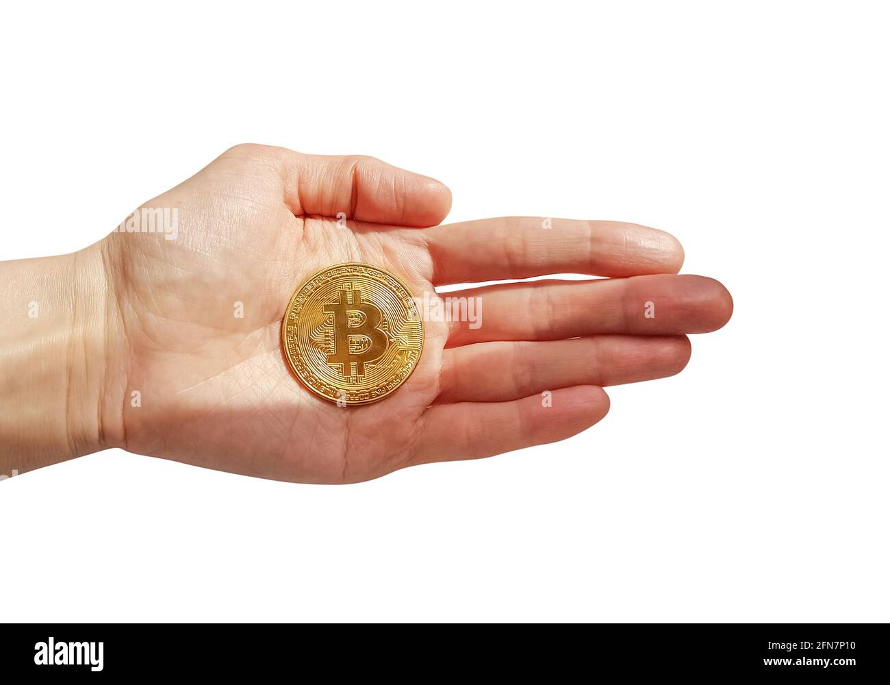Moneta gettone Bitcoin nella mano della donna isolata su sfondo bianco Foto Stock