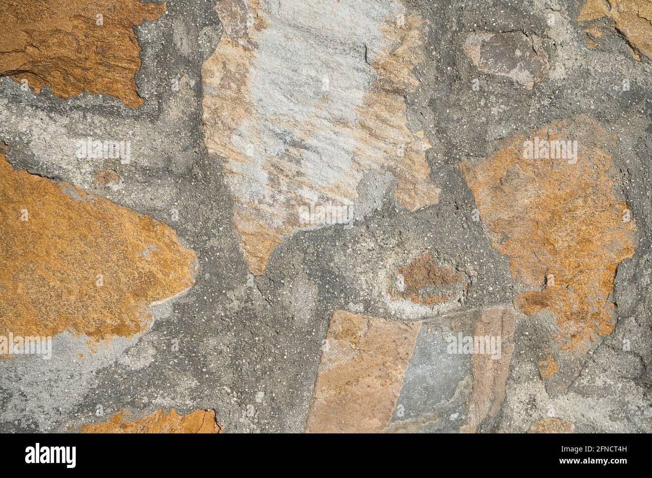muro di pietra, con texture come sfondo. vista Foto Stock