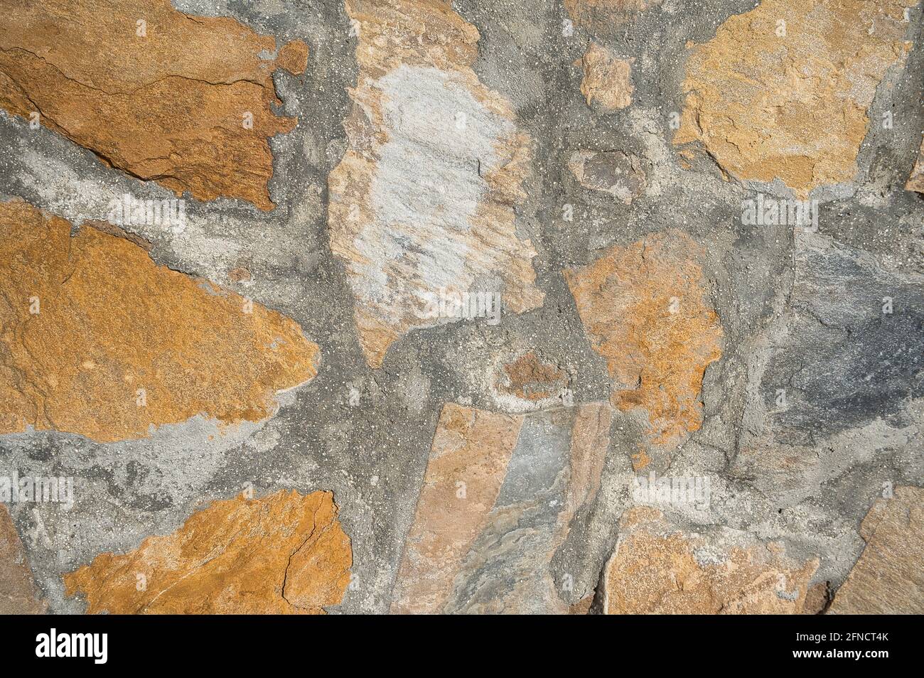 muro di pietra, con texture come sfondo. vista Foto Stock