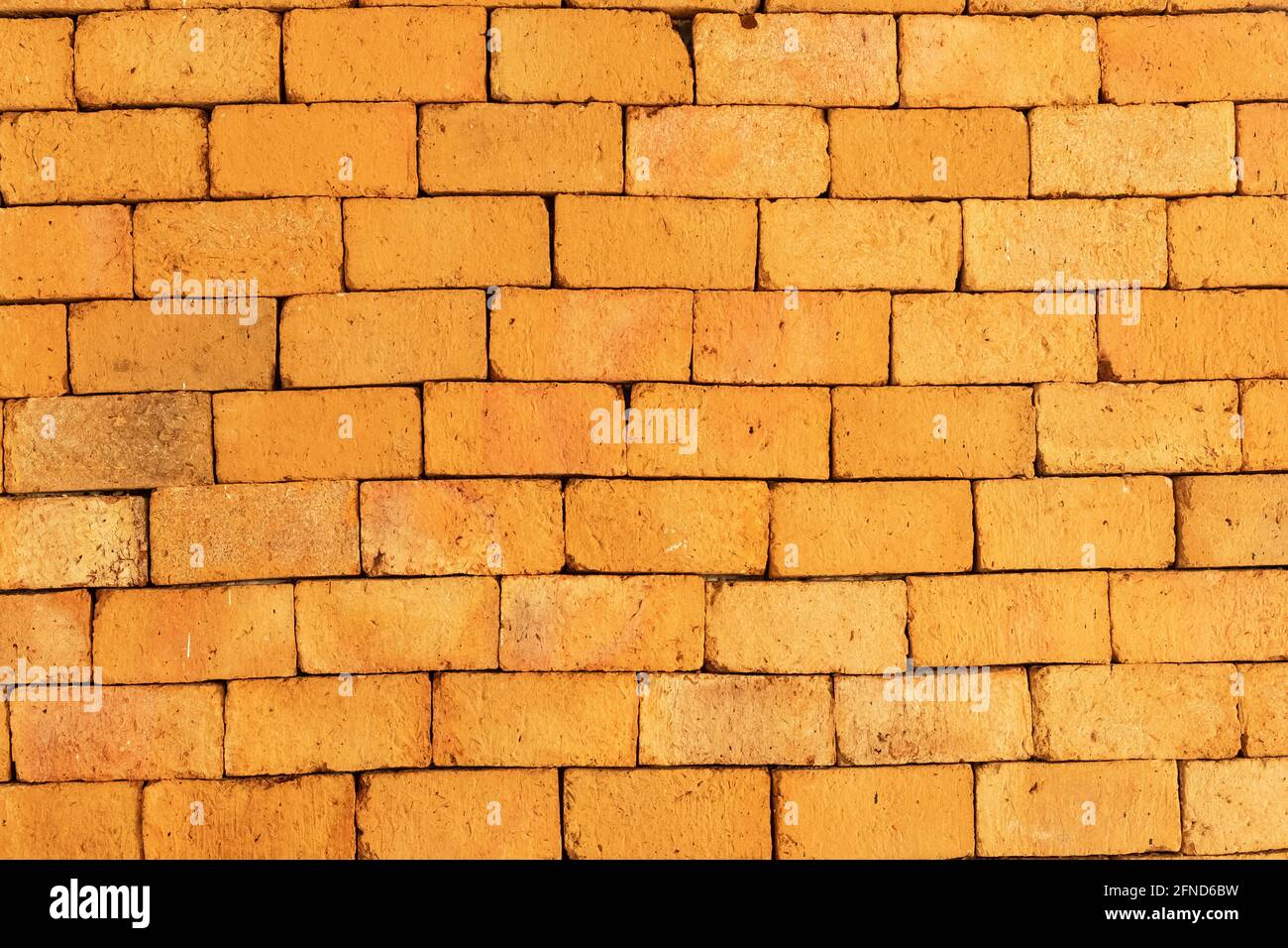 Sfondo muro arancione senza cuciture. Sfondo muro arancione mattone grunge Foto Stock