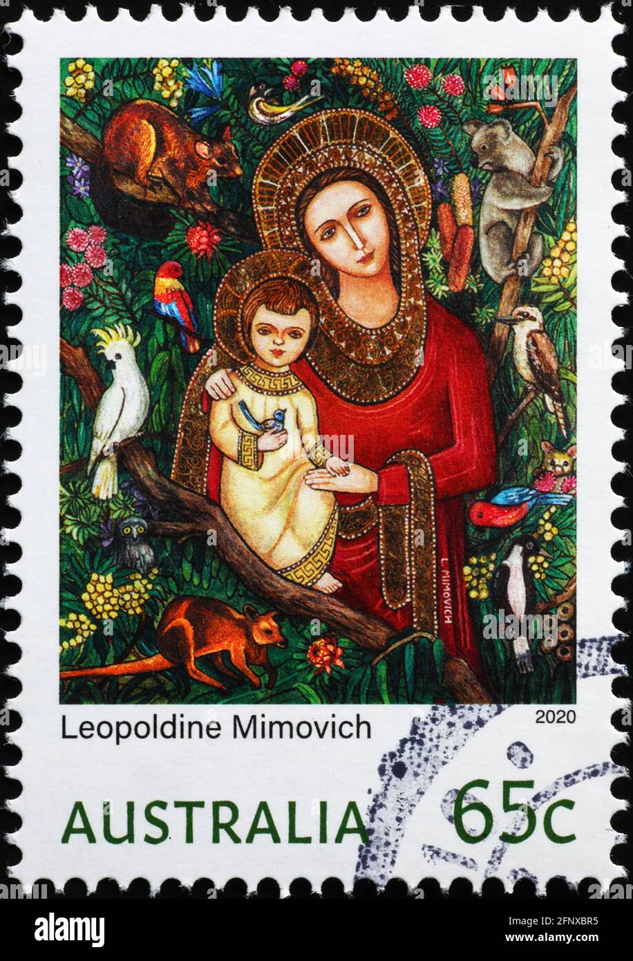 Madonna e Gesù bambino circondato da animali australiani sul timbro Foto Stock