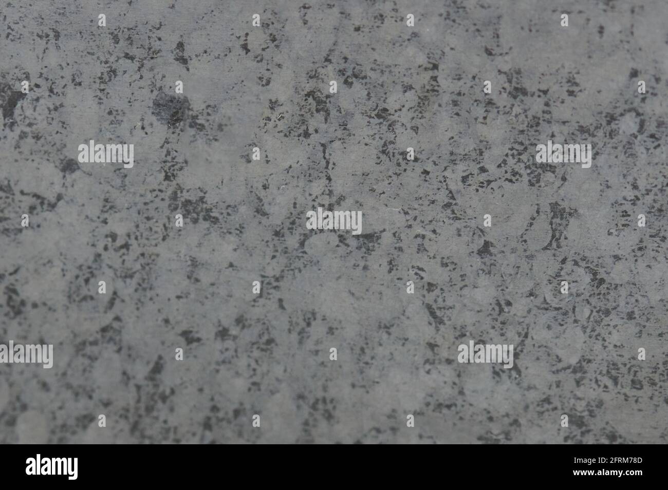 Vista ravvicinata della macro di superficie metallica ruvida grigia astratta Foto Stock