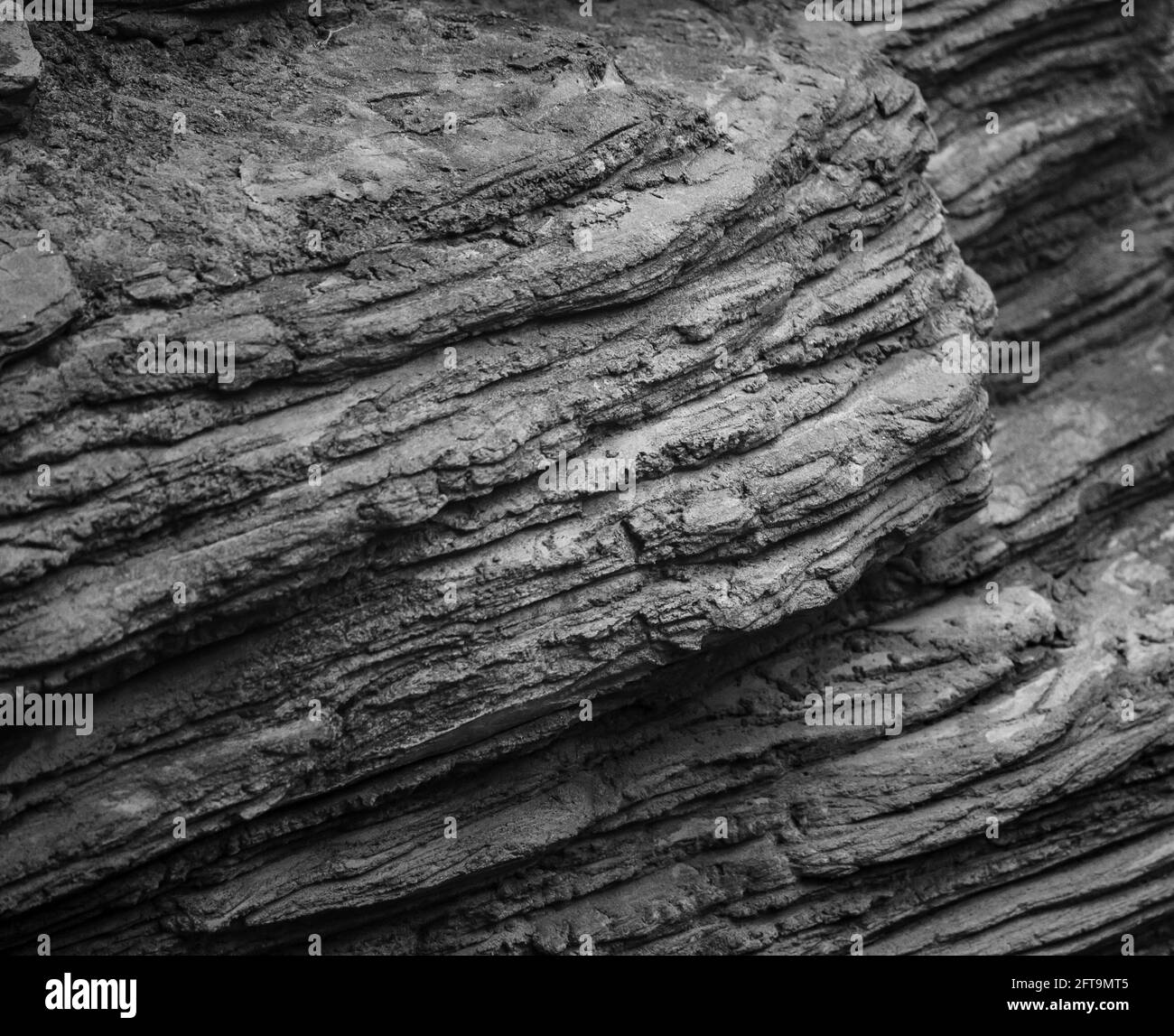 Bella texture della parete in pietra in tonalità monocromatiche Foto Stock