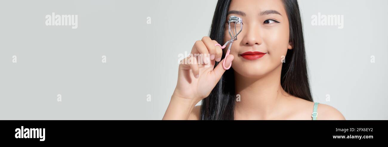 giovane attraente donna asiatica bellezza immagine,eyelash arricciacapelli Foto Stock