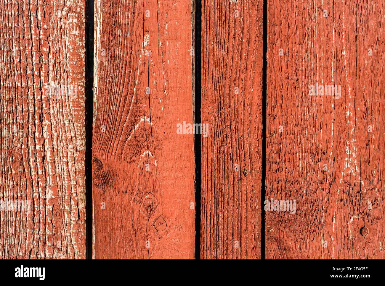 Sfondo di tessitura di legno. Vecchie tavole di legno di colore rosso. Foto Stock