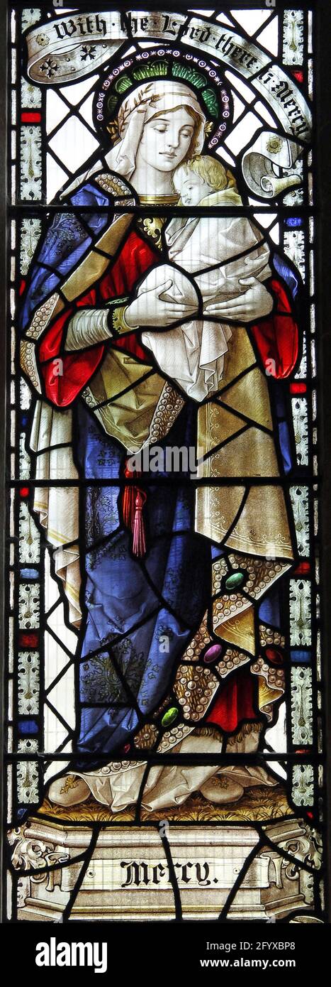 Vetrata di Percy Bacon & Brothers raffigurante Mercy, St George's Preshute, Wiltshire Foto Stock