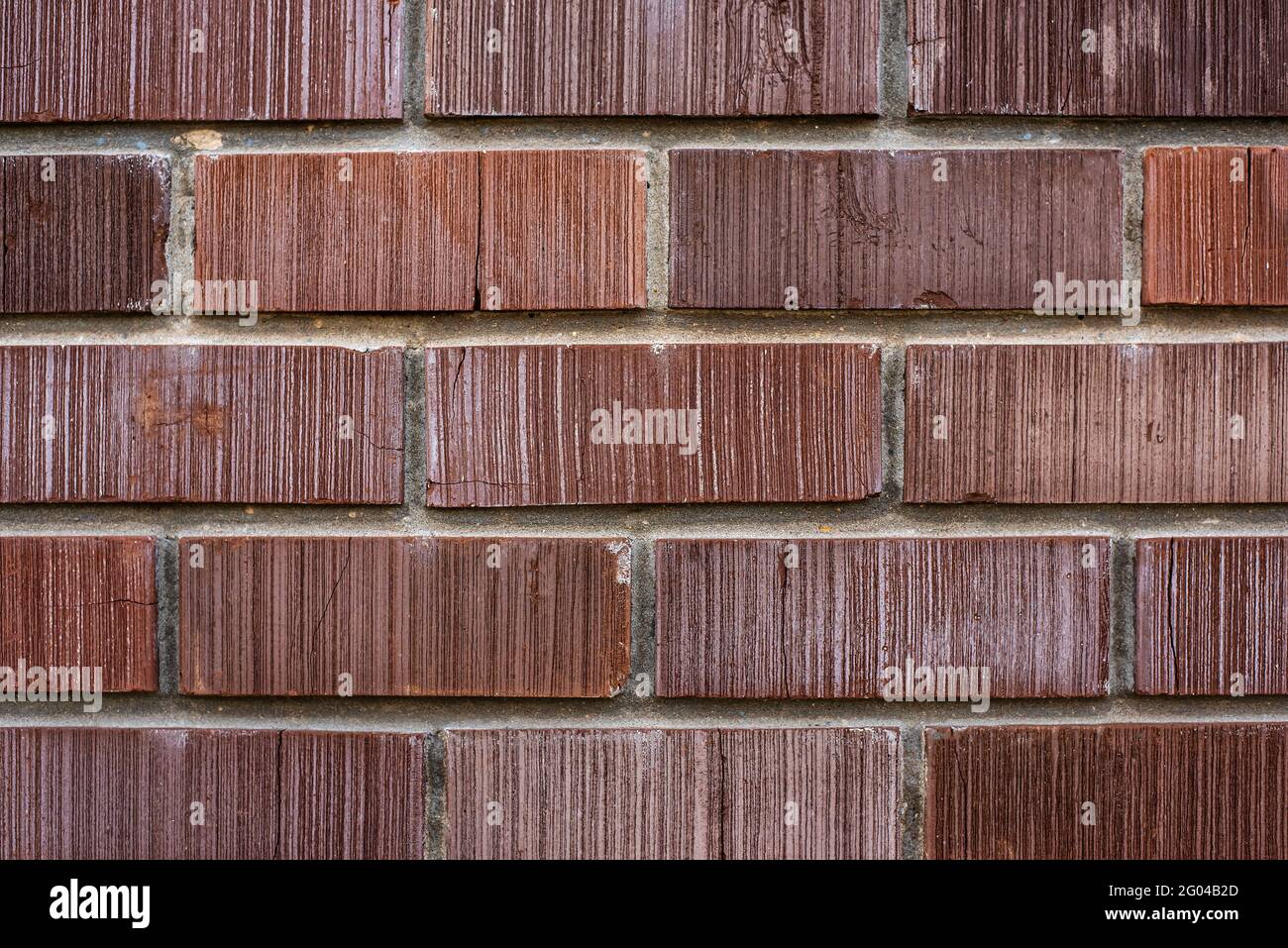 Muro di nuovo edificio fatto con mattoni rossi vista ravvicinata Foto Stock