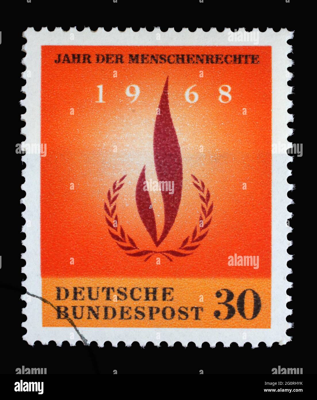 Francobollo stampato in Germania con alloro e corona, anno dei diritti umani, circa 1968 Foto Stock