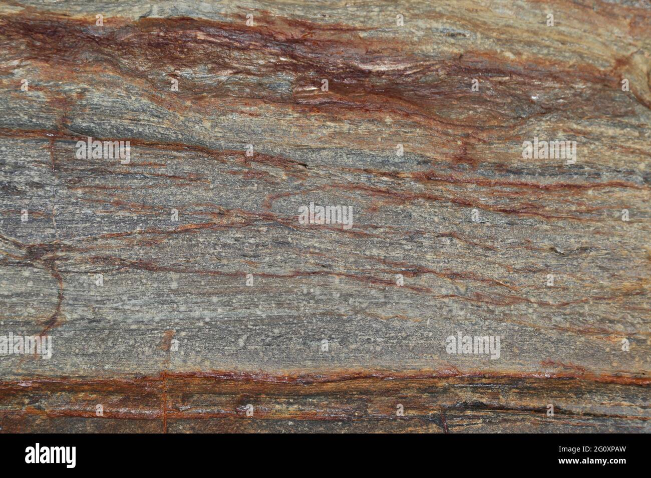 Formazione rocciosa sedimentaria stratificata metamorfica con deposito di ferro vista dall'alto texture sfondo Foto Stock