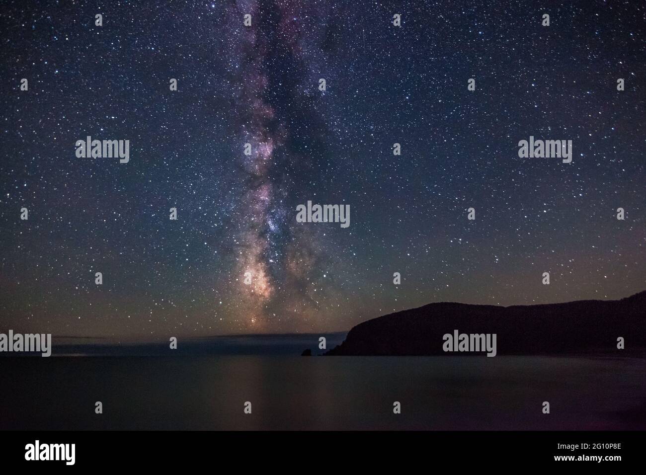 Via lattea sul mare. Un po' di rumore ISO elevata esistente Foto Stock