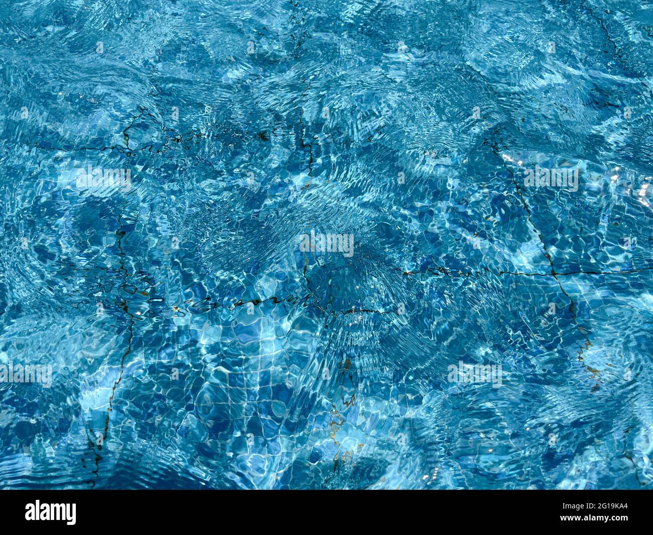 Piscina acqua superficie onda trama sfondo. Concetto di vacanze estive. Foto Stock