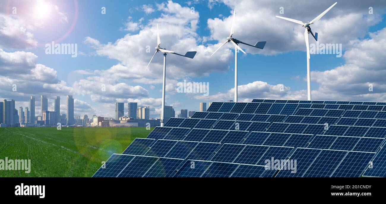 Turbine eoliche e pannelli solari. Grattacieli all'orizzonte. Concetto di città ecologica Foto Stock