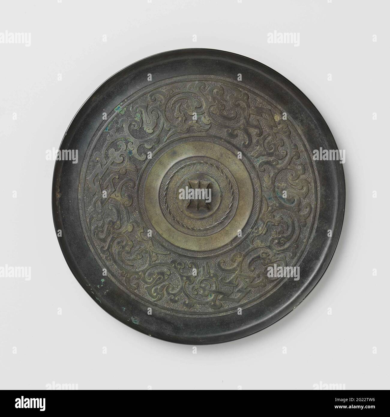 Specchio con uccelli stilizzati-dragon dei motivi. Foto Stock