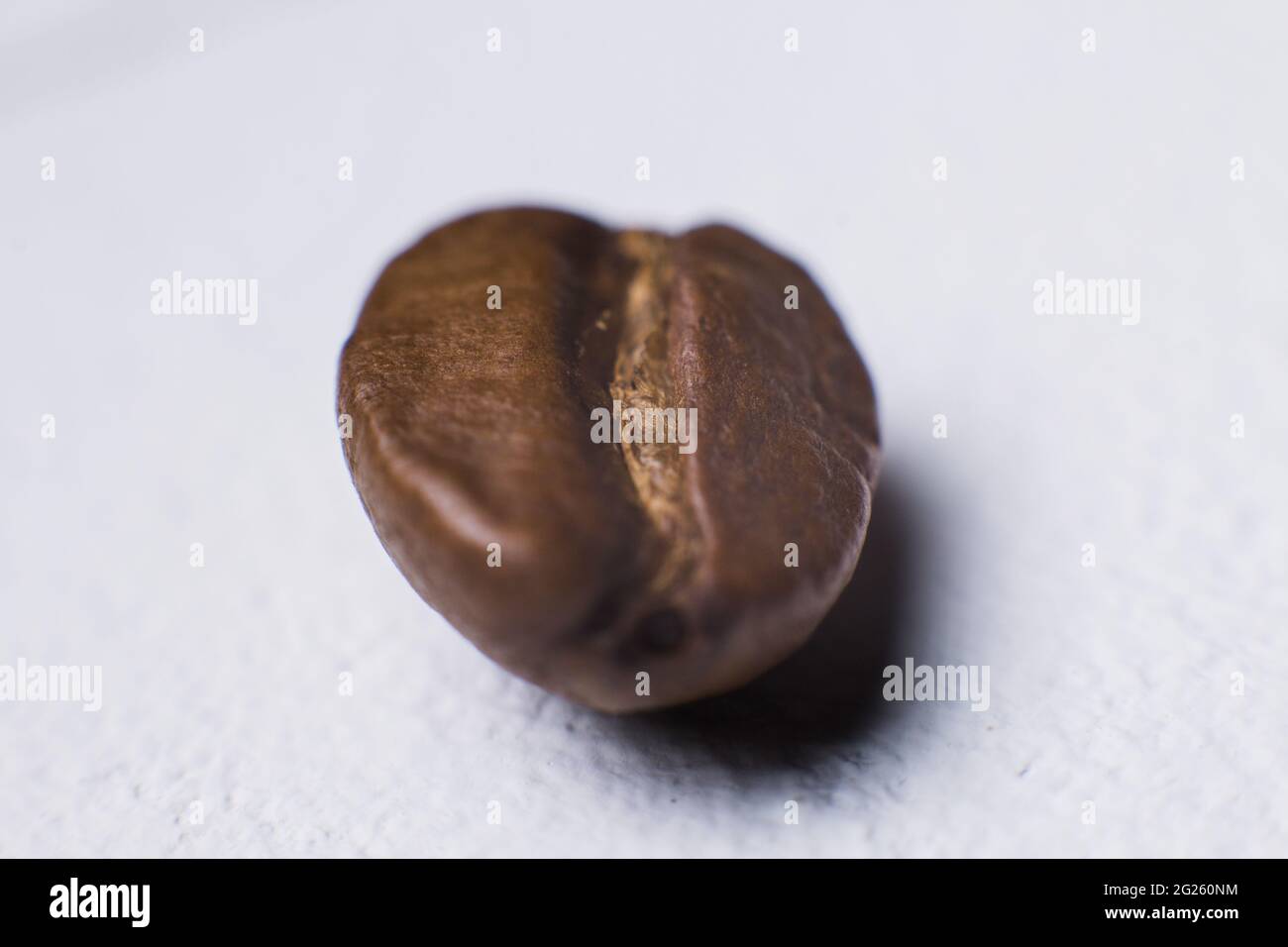 un caffè fagioli primo piano macro sfondo Foto Stock