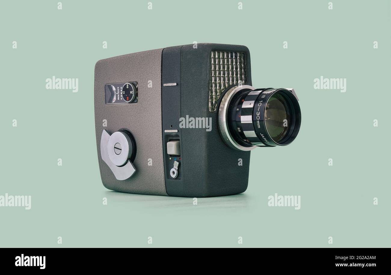 Videocamera retro Film su sfondo blu verde Foto Stock