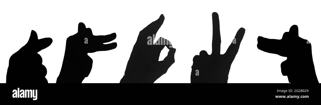Set di silhouette o ombra nera delle mani che mostrano la forma del cuore, ok, vittoria, cane, animale isolato su sfondo bianco, primo piano. Elementi per il vostro cre Foto Stock