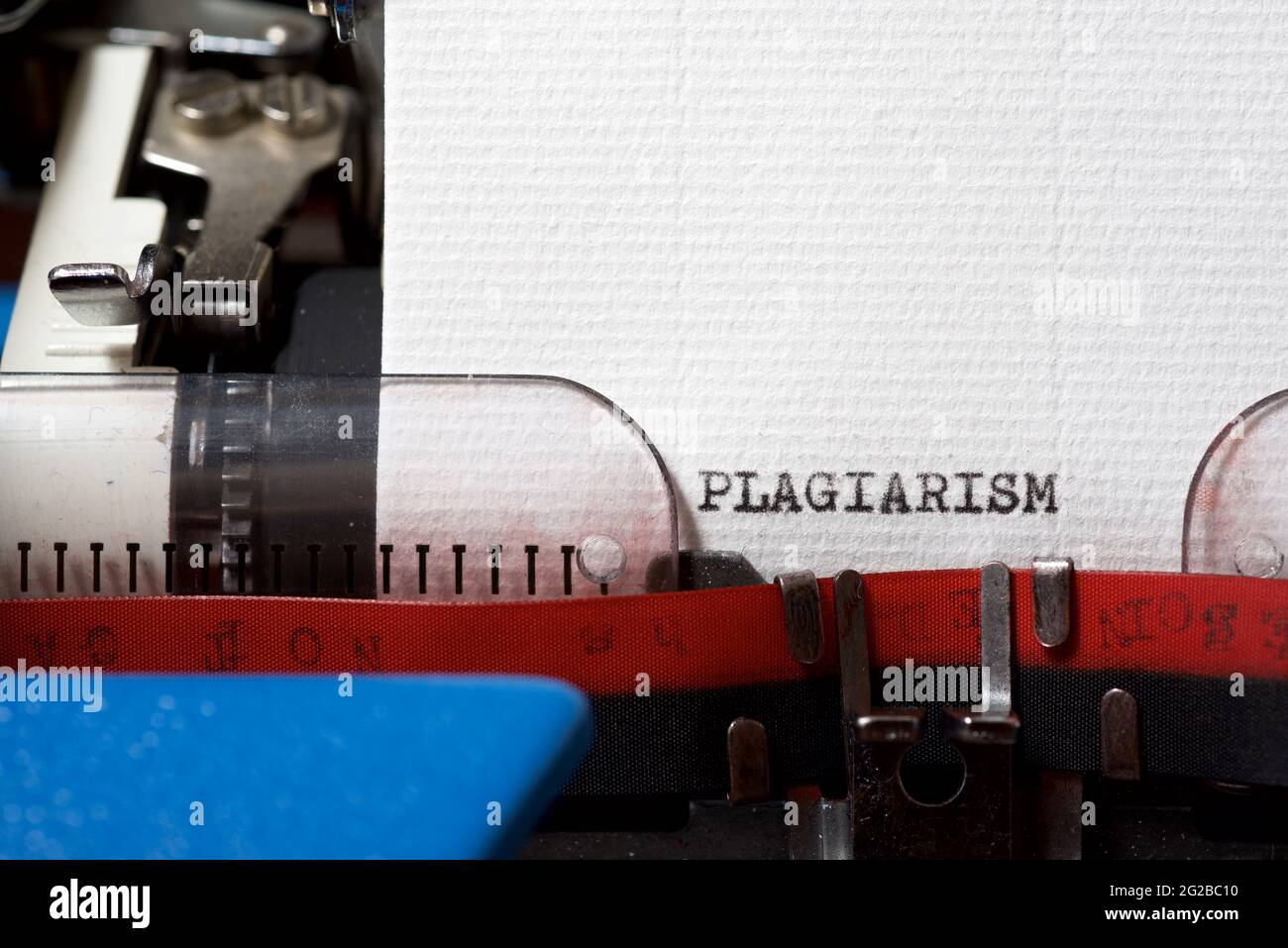 La parola plagio scritto con una macchina da scrivere. Foto Stock