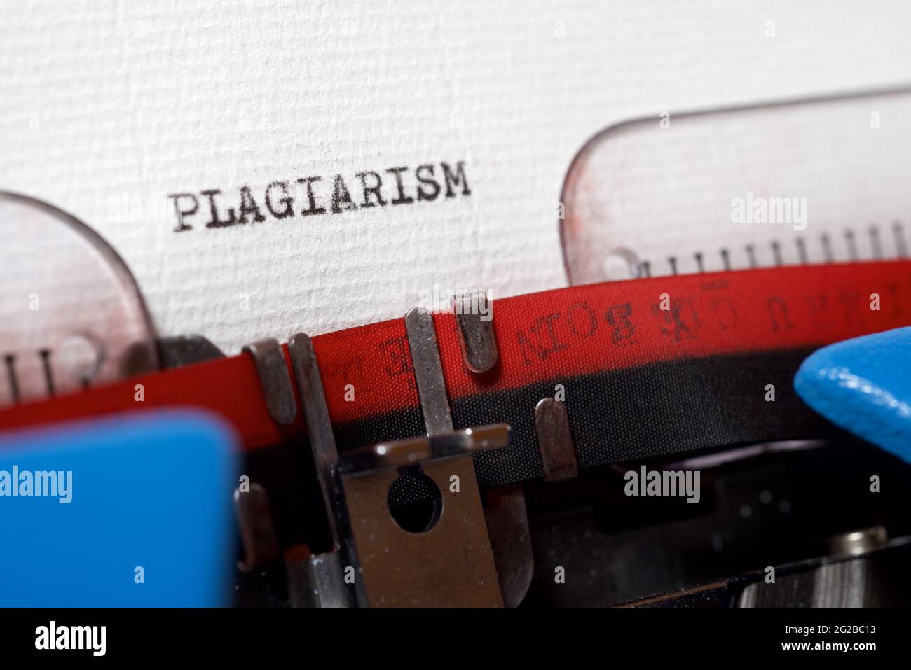 La parola plagio scritto con una macchina da scrivere. Foto Stock