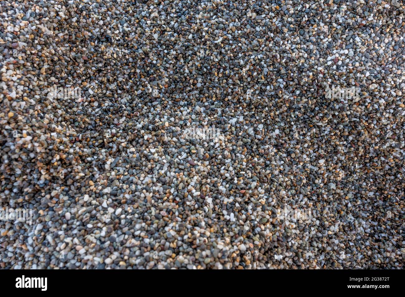 Vista ravvicinata della sabbia ruvida sulla spiaggia. Foto Stock