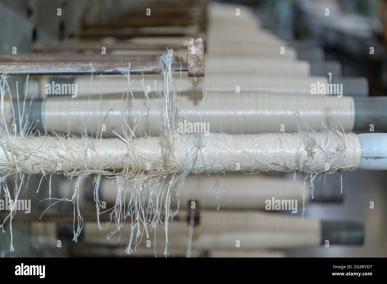 bobine e funi tessili, macchina tessile Foto Stock