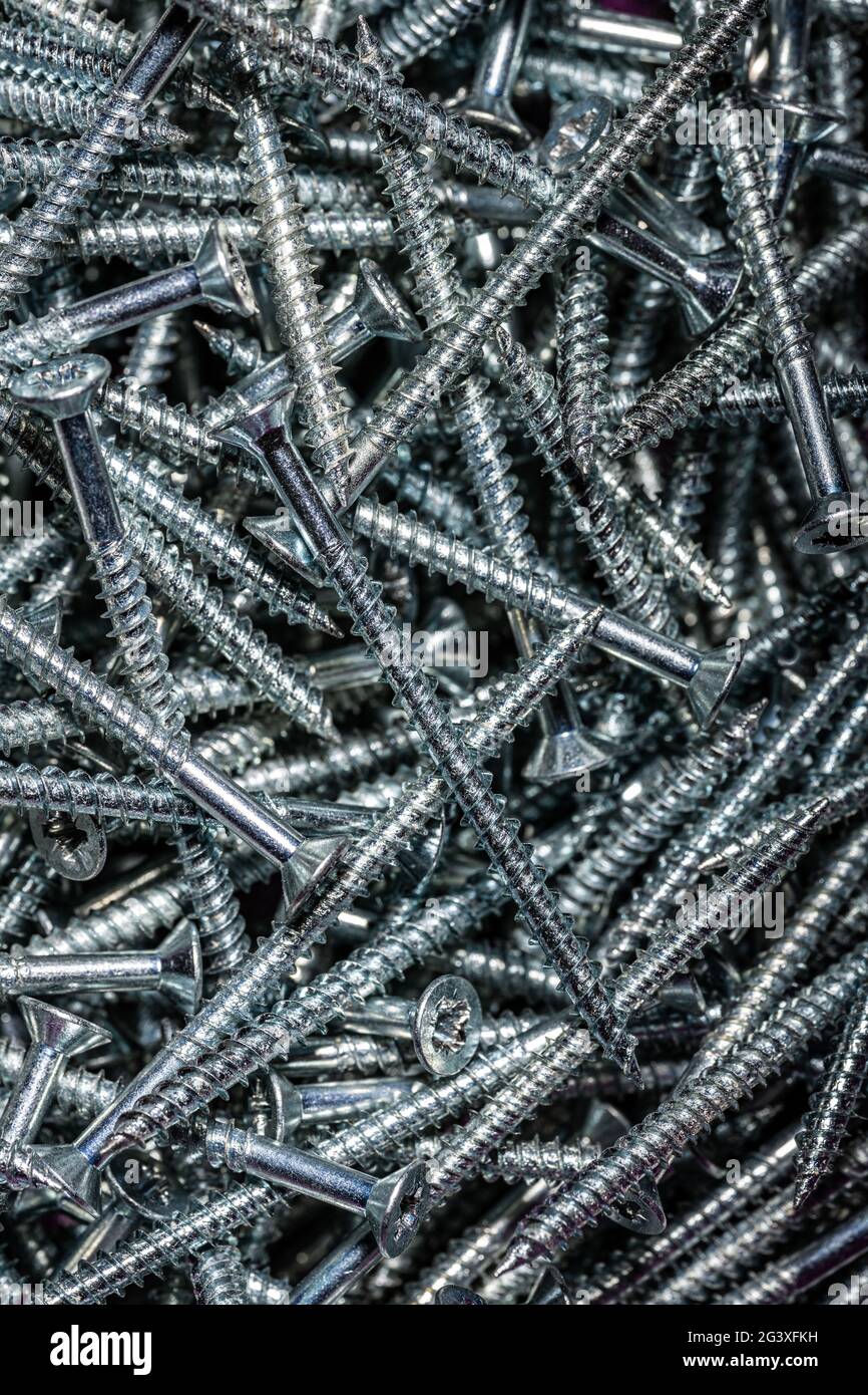 Viti di legno di acciaio accatastate Foto Stock