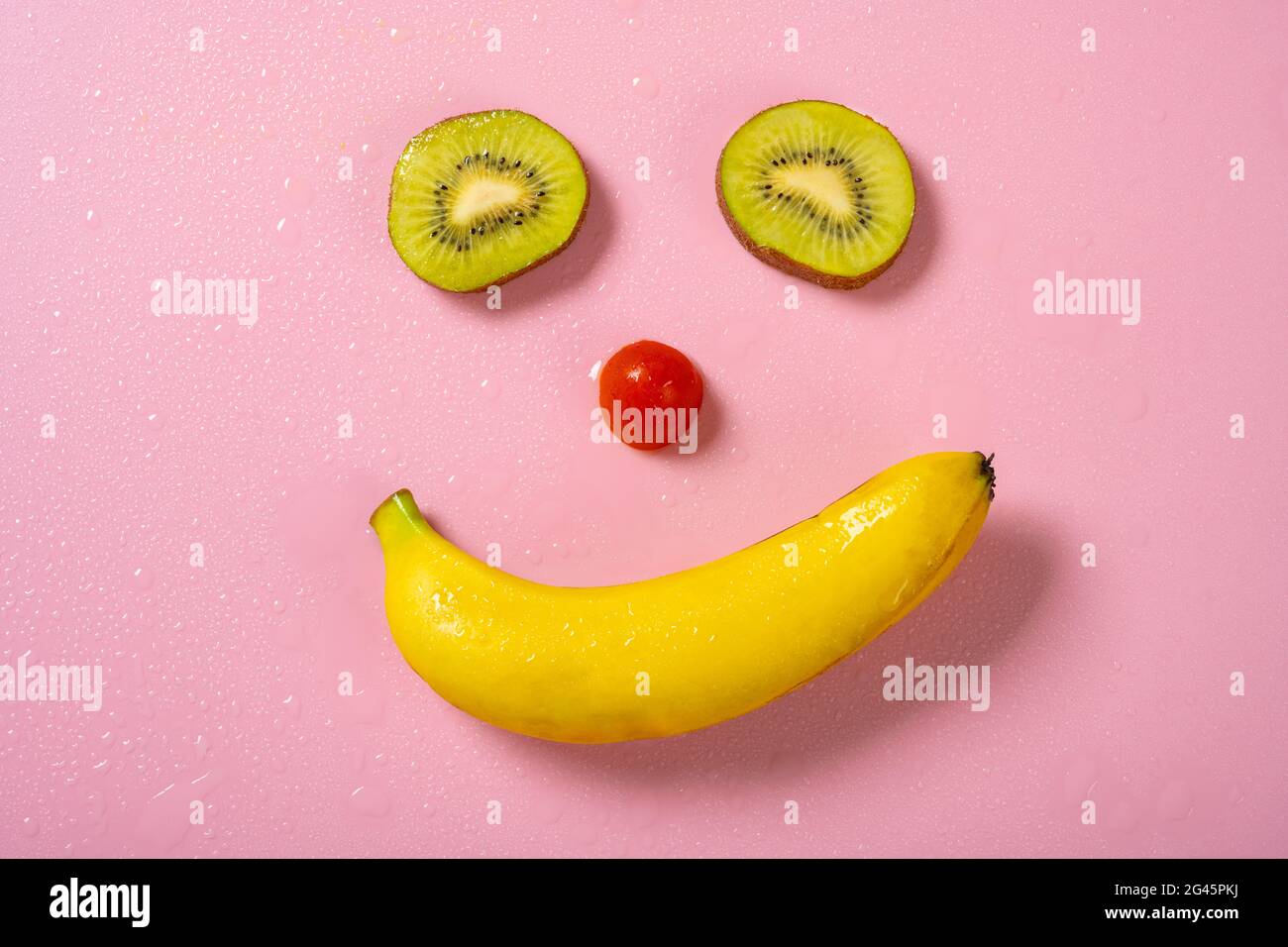 faccia sorridente a forma di kiwi e banana Foto Stock