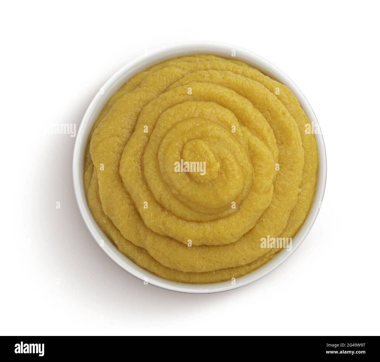 Senape nel recipiente isolato su sfondo bianco, vista dall'alto Foto Stock