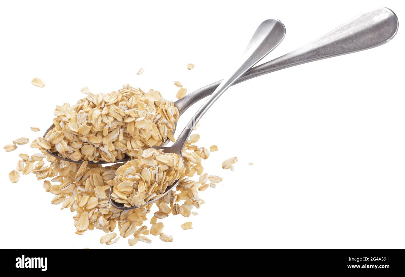Fiocchi di avena in cucchiaio isolati su sfondo bianco Foto Stock