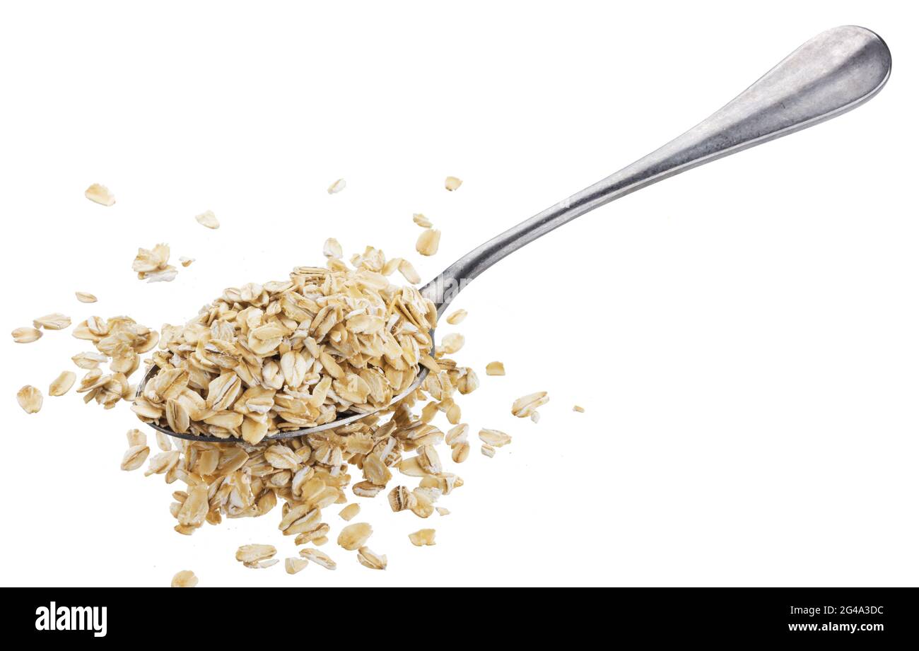 Fiocchi di avena in cucchiaio isolati su sfondo bianco Foto Stock
