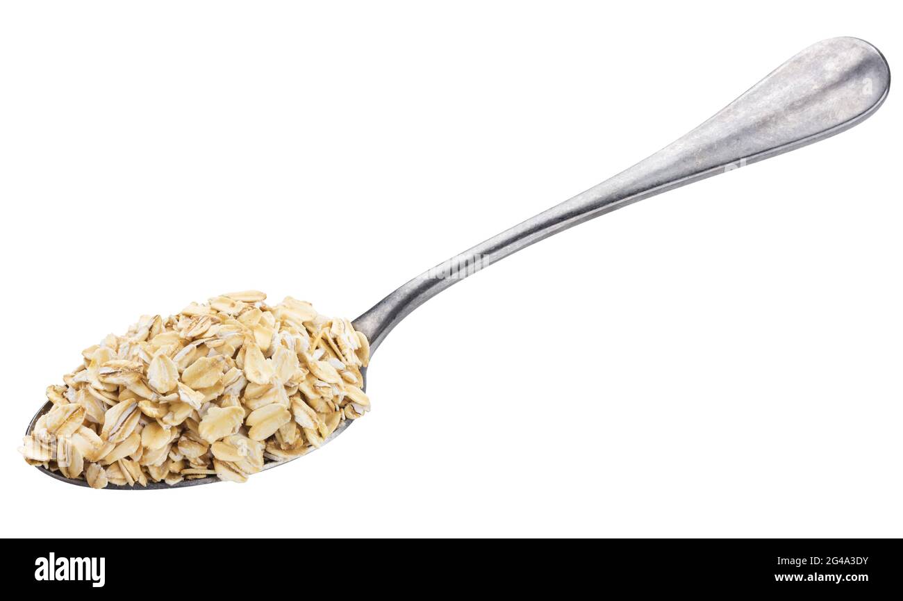 Fiocchi di avena in cucchiaio isolati su sfondo bianco Foto Stock