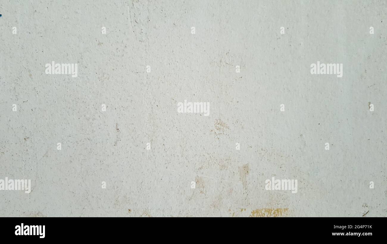 Un vecchio muro di cemento bianco usato come sfondo. Foto Stock