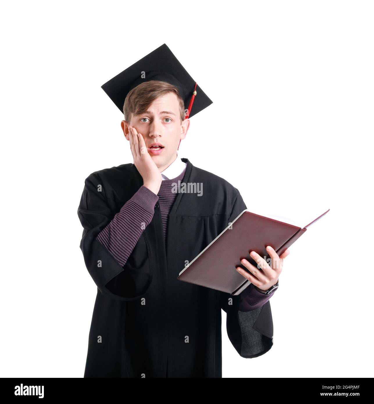 Studente laureato scioccato su sfondo bianco Foto Stock