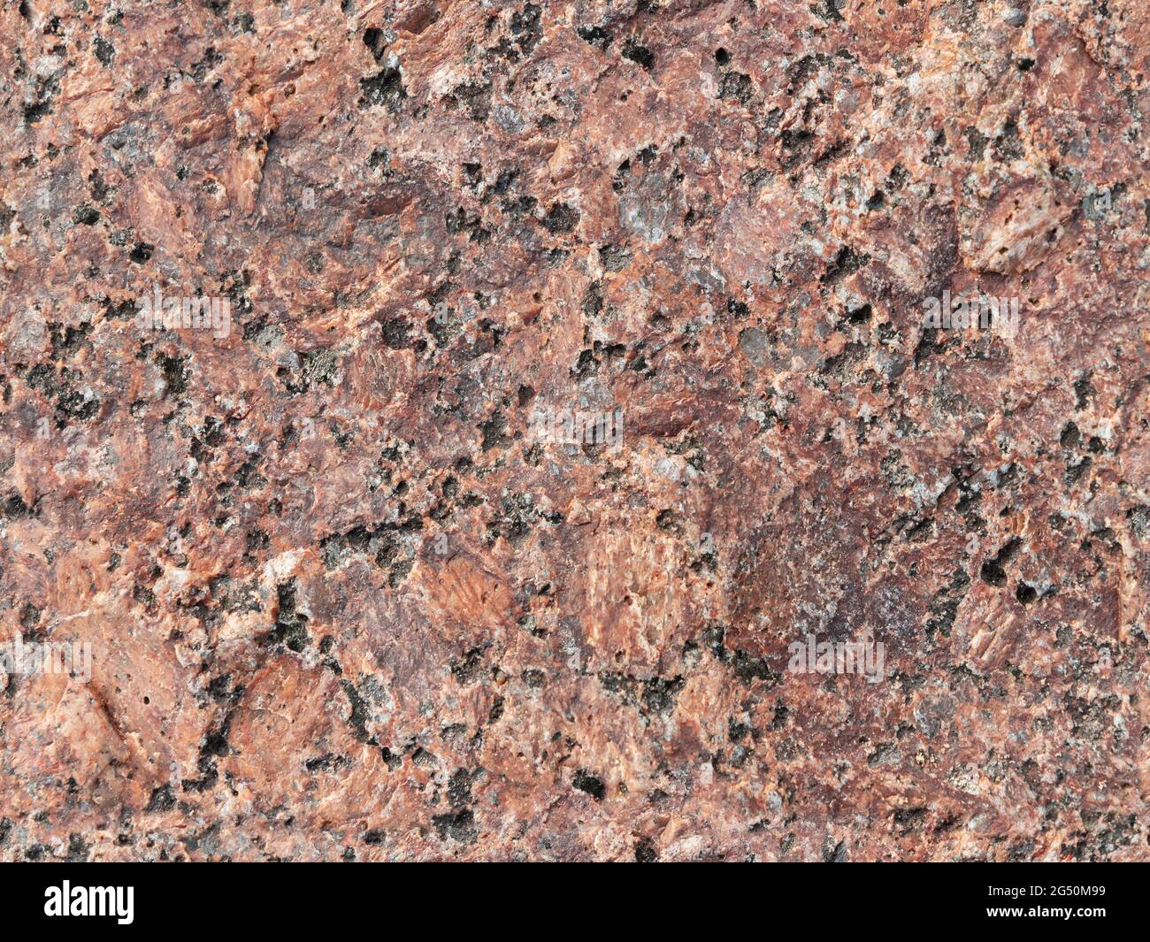 Superficie in pietra di granito marrone rosso naturale, struttura fotografica di sfondo senza cuciture Foto Stock