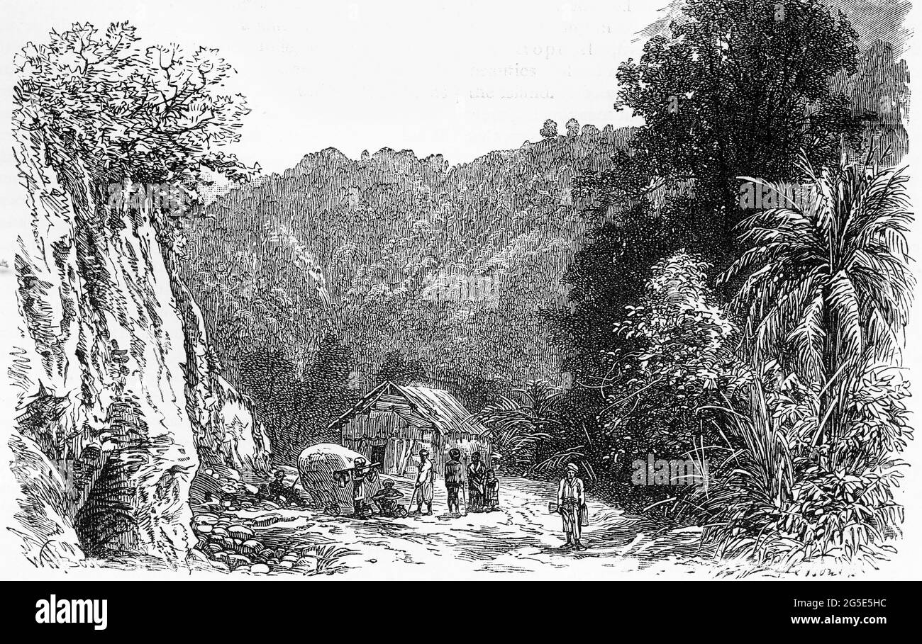 Incisione di un villaggio profondo nella giungla in Borneo, da una pubblicazione circa 1880 Foto Stock
