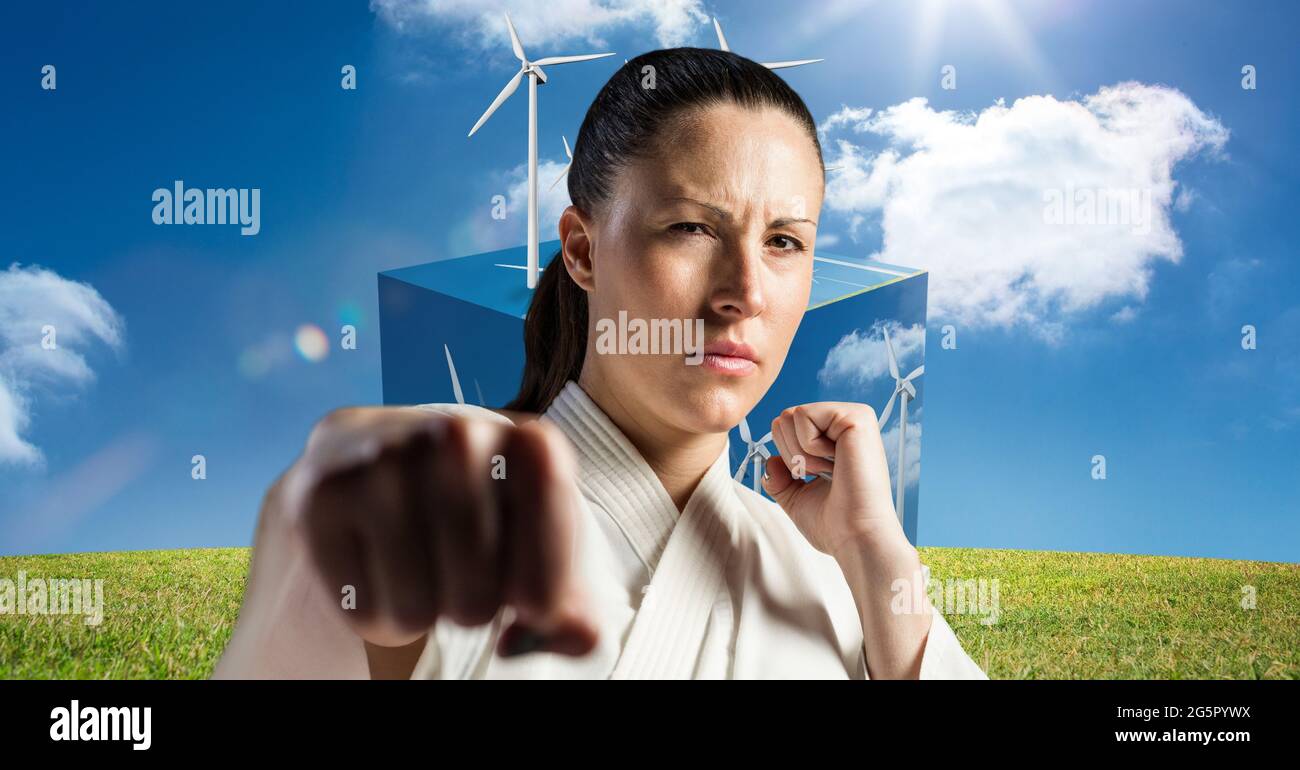 Immagine digitale composita di ritratto di artista coniugale caucasico contro mulini a vento Foto Stock