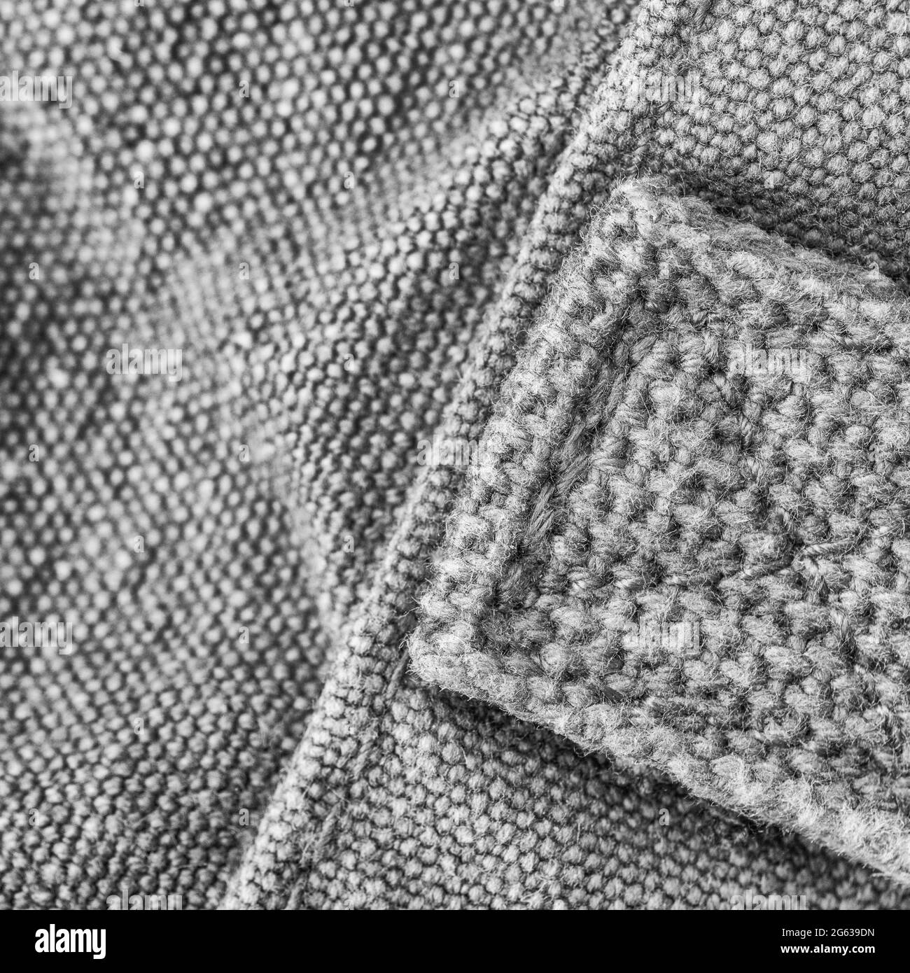 Immagine macro in primo piano astratta in bianco e nero di cuciture per impieghi pesanti / punti di articoli in tela. Per cucire in idioma di tempo, ben sicuro, abilità all'aperto. Foto Stock