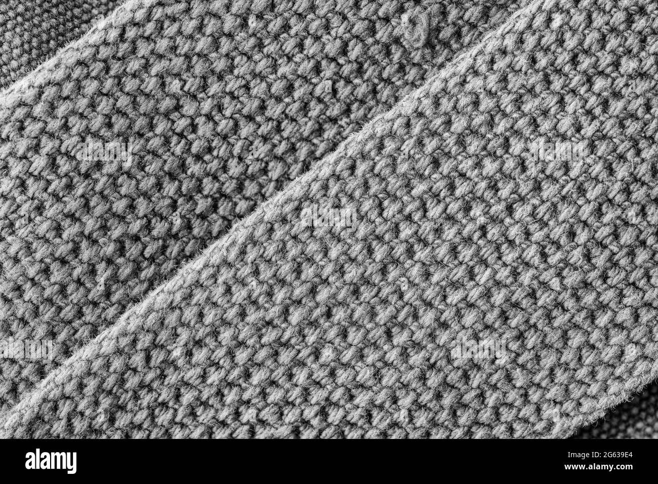 Immagine macro in primo piano astratta in bianco e nero di cuciture per impieghi pesanti / punti di articoli in tela. Per cucire in idioma di tempo, ben sicuro, abilità all'aperto. Foto Stock