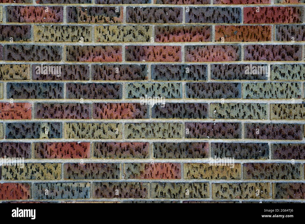 Una texture shot di mattoni multicolore. Foto Stock