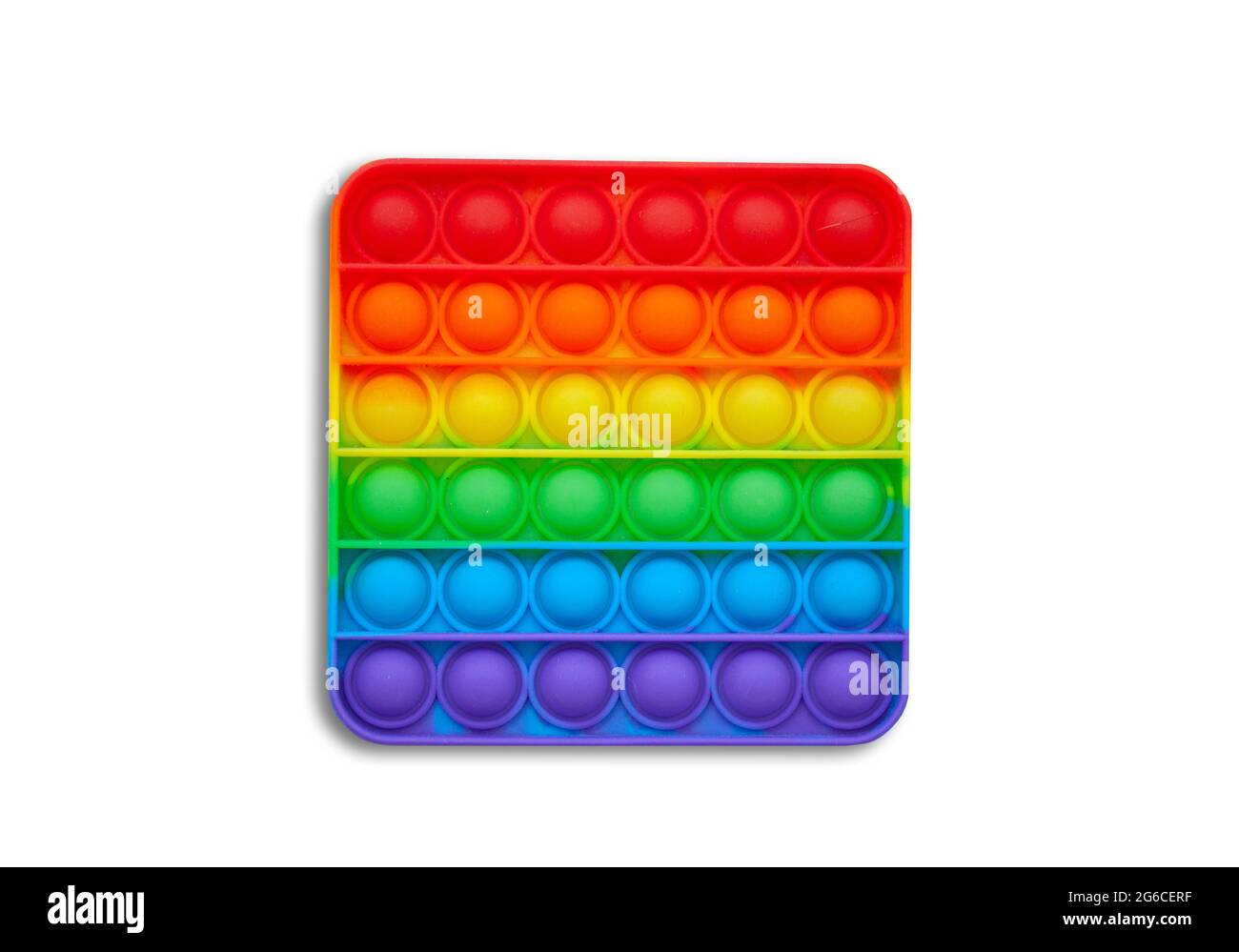 Giocattolo in silicone antistress popit. Nuova tendenza. Colorato anti stress sensoriale giocattolo fidget push pop it . Disposizione piatta con copyspace. Foto Stock