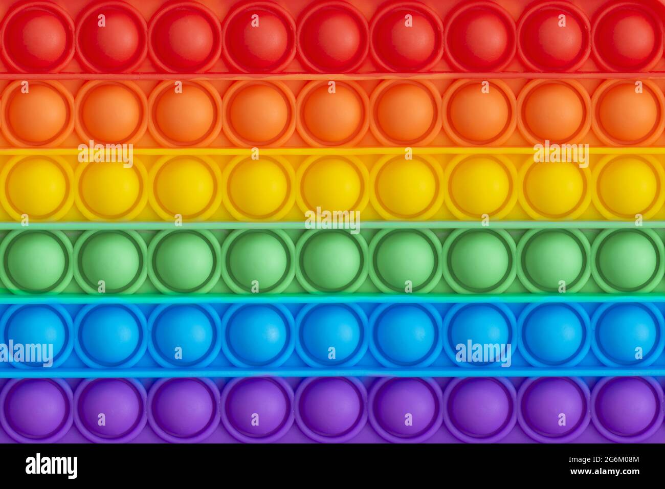 Giocattoli sensoriali anti-stress pop it per bambini. Motivo colorato Foto Stock