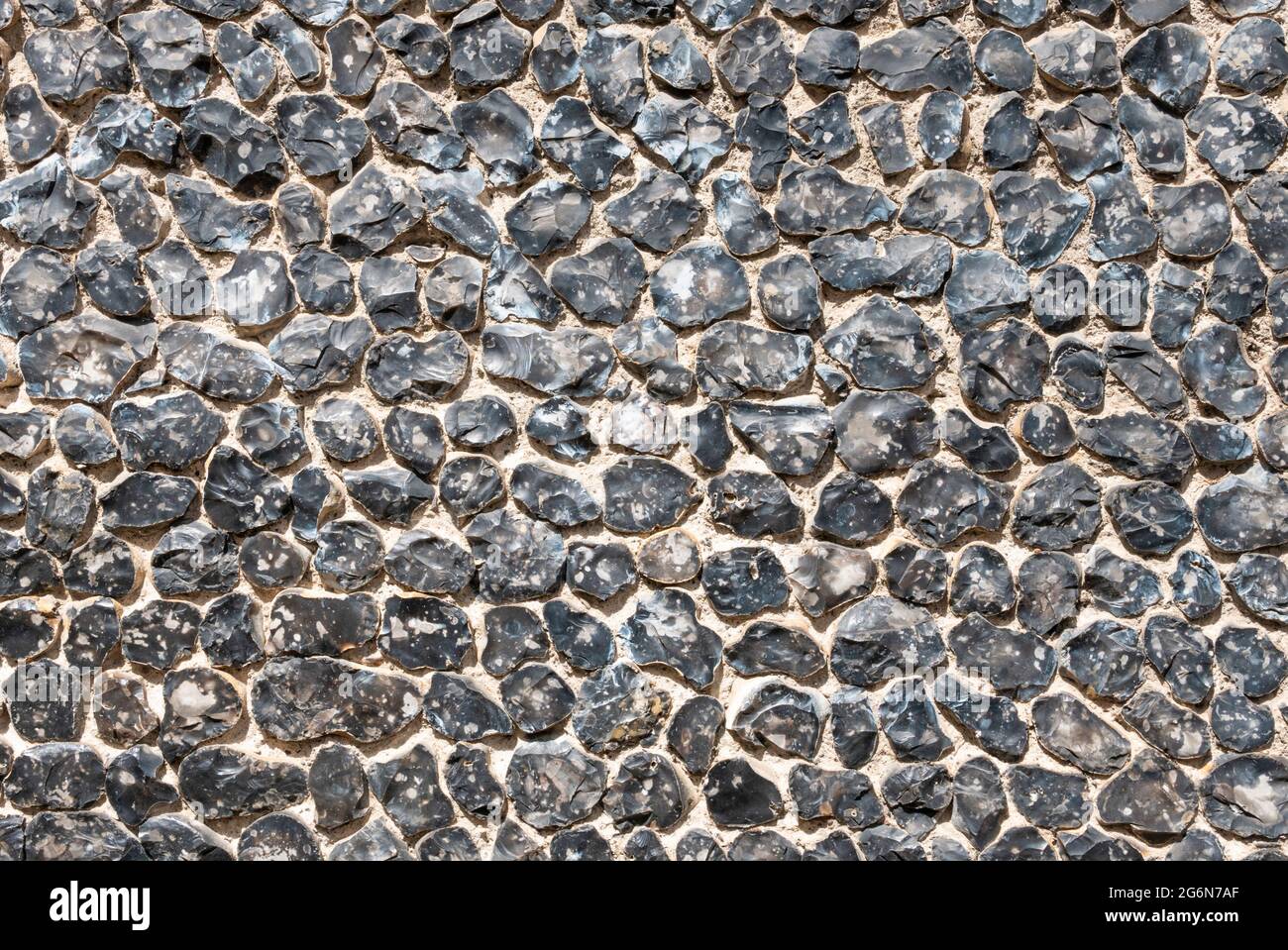 Knapped Flint wall Kent England UK GB Europe - pietra e selce parete texture sfondo Foto Stock