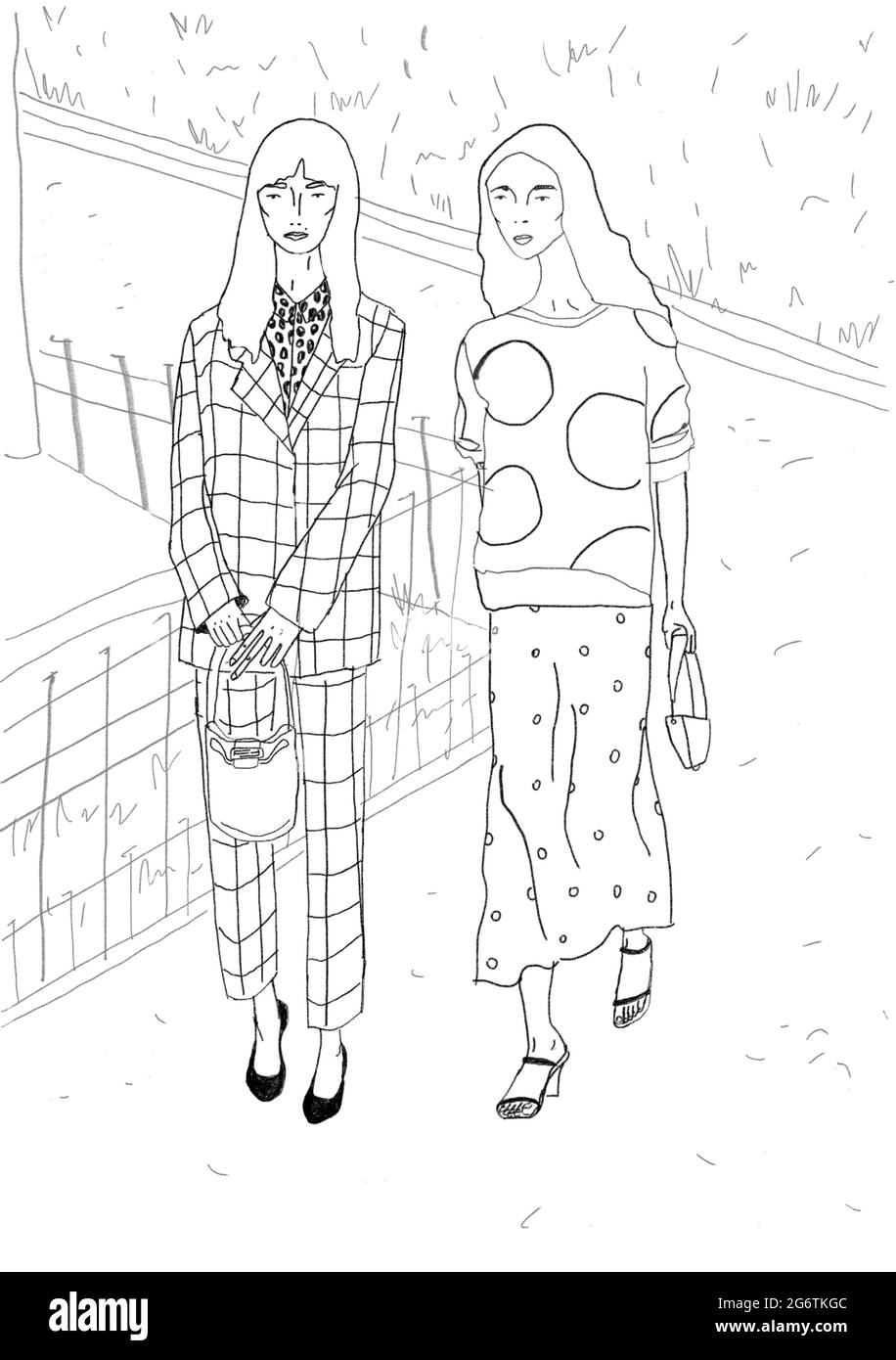 Due ragazze di moda che camminano nel parco Foto Stock