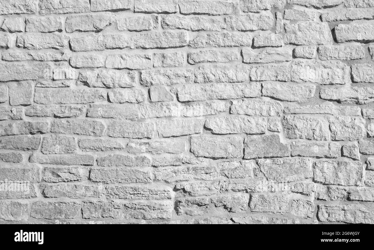 Parete di mattone bianca ruvida, texture di foto di sfondo ravvicinata Foto Stock